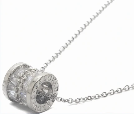 Cadena de acero quirurgico con dije rodillo con cubic y micro pave cristal 40cm + 5cm